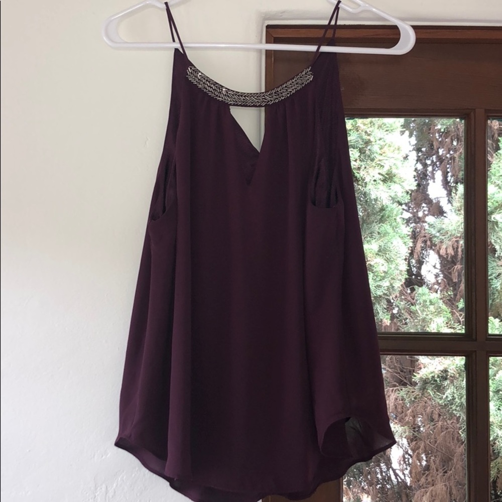 Beautiful top with triangle cutout & beaded detail